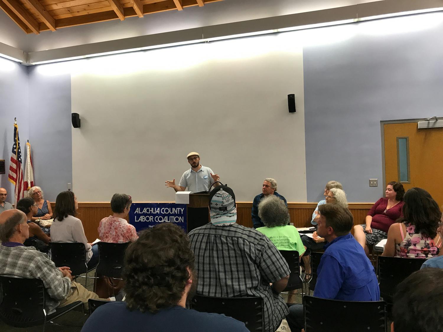Alachua County Labor Coalition organizer Jeremiah Tattersall addresses a crowd at the Santa Fe College Living Wage Campaign Kick Off at 6 p.m. on Thursday.