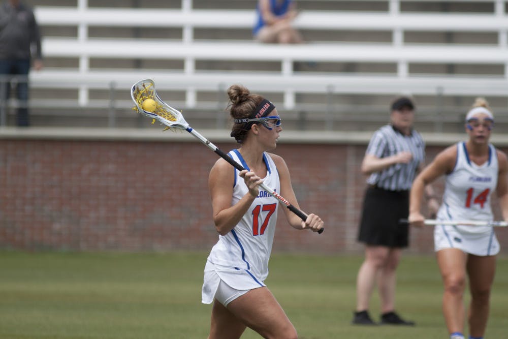 UF attacker Mollie Stevens prepares to pass during Florida's 15-8 victory over Denver on March 25, 2017, at Donald R. Dizney Stadium.