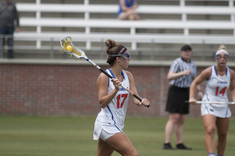 <p>UF attacker Mollie Stevens prepares to pass during Florida's 15-8 victory over Denver on March 25, 2017, at Donald R. Dizney Stadium.</p>