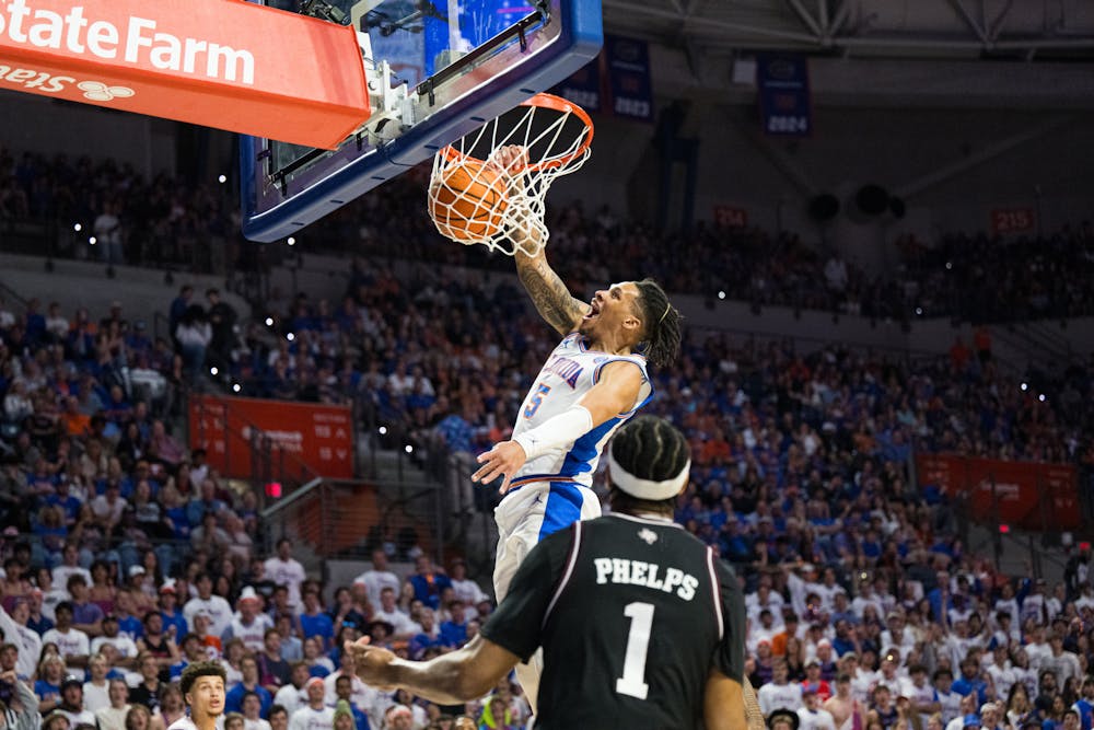 <p>Florida Gators guard Will Richard (5) dunks the ball in a basketball game against Texas A&amp;M on Saturday, March 1, 2025, in Gainesville, Fla.</p>