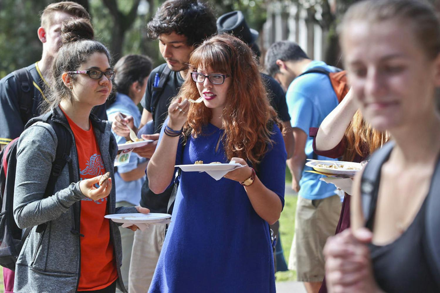 McShane Ingalls, left, a 20-year-old UF nutritional sciences junior, and Kristen Ratliff, a 21-year-old political science senior, eat a vegan Thanksgiving meal at the Plaza of the Americas on Nov. 20, 2015. The Student Animal Alliance provided a lunch of Tofurkey, mashed potatoes, gravy and cookies as well as literature on the importance of going vegan.