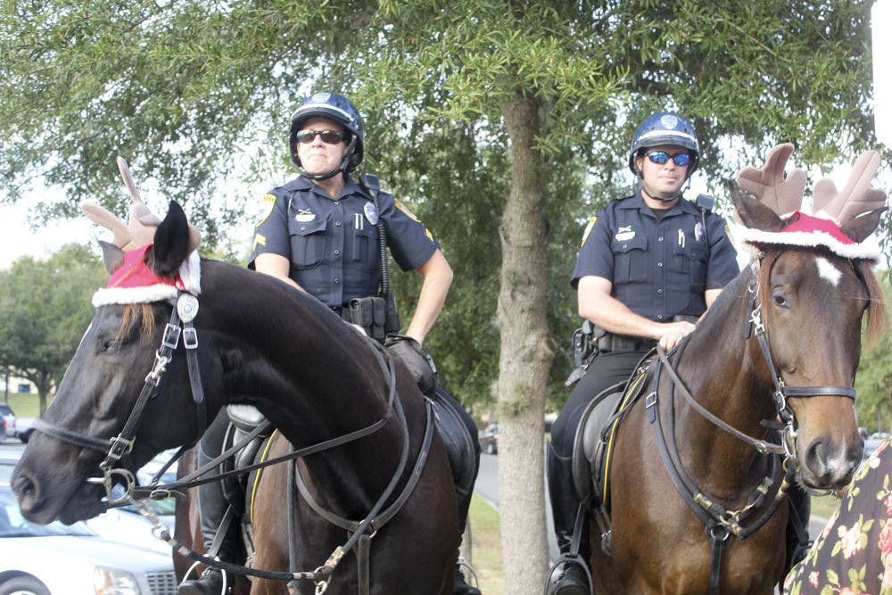 <p class="p1">Gainesville Police Cpl. Tracy Fundenburg, left, sits on police horse Zeus, and GPD Officer Tom Lardner sits on police horse Bolt, outside The Oaks Mall on Friday afternoon. Bolt will replace retired police horse Blue.</p>