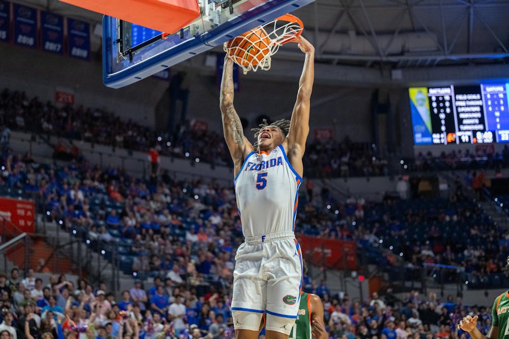 <p>Florida Gators guard Will Richard (5) dunks the ball during a basketball game against Florida A&amp;M University on November 19, 2024, in Gainesville, Florida.</p>