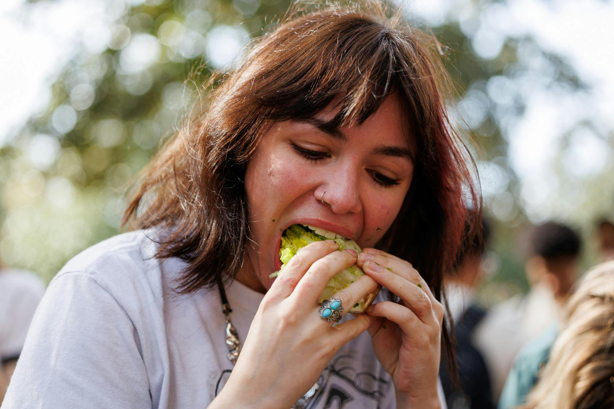 Junior Charley Fike takes a bite of lettuce during the UF Lettuce Club’s lettuce eating competition on Thursday, Feb. 19, 2026, in Gainesville, Fla.