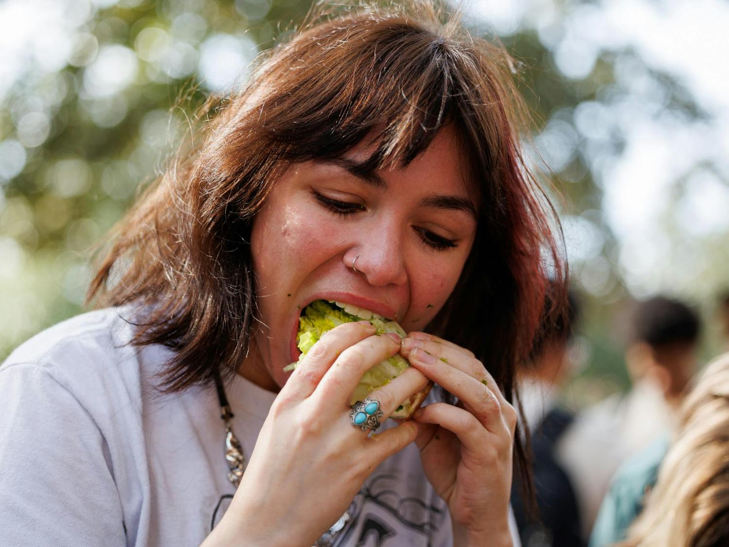 Junior Charley Fike takes a bite of lettuce during the UF Lettuce Club’s lettuce eating competition on Thursday, Feb. 19, 2026, in Gainesville, Fla.