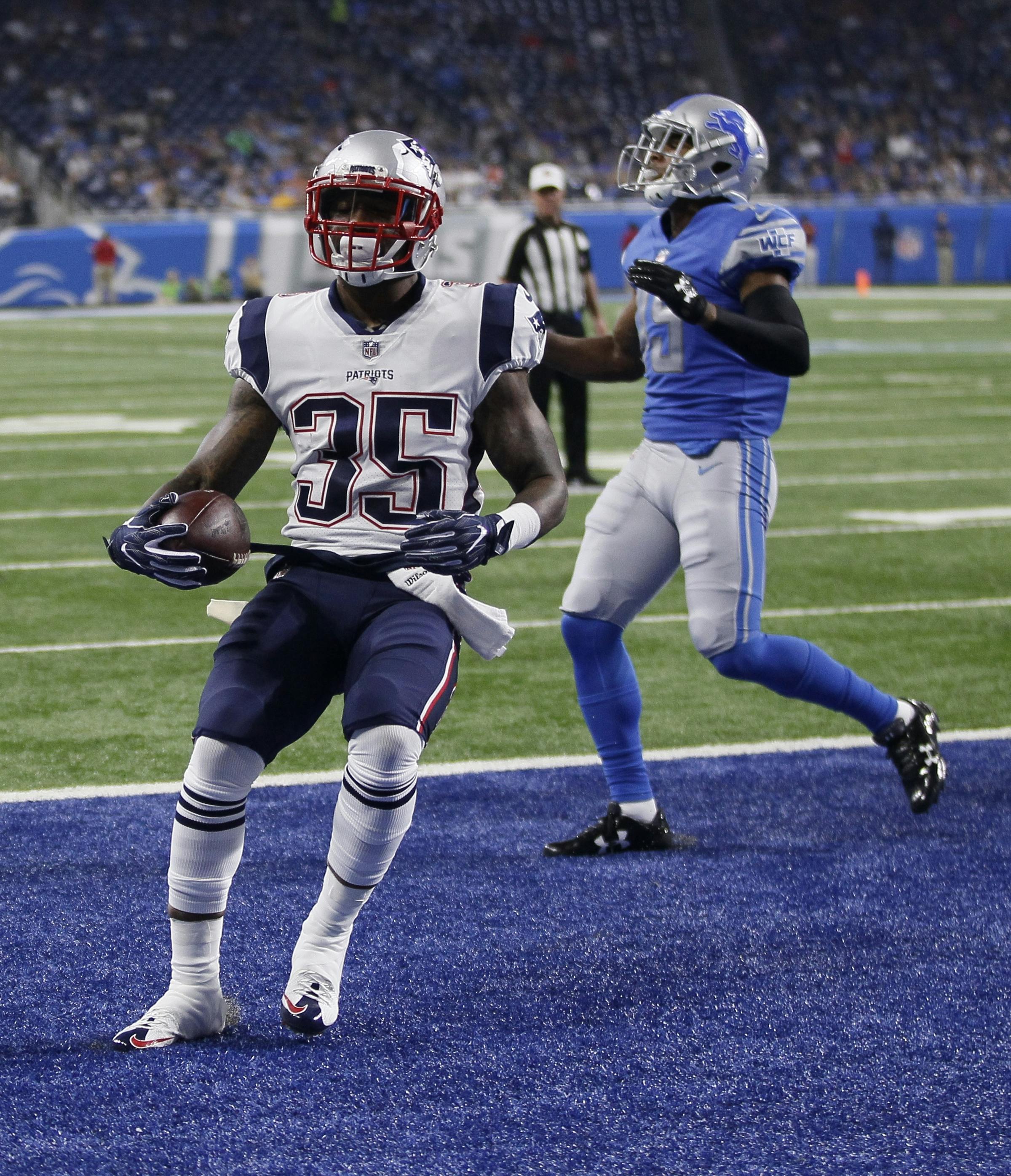 New England Patriots running back Mike Gillislee (35) runs into the end zone for a 1-yard touchdown during the first half of an NFL preseason football game against the Detroit Lions, Friday, Aug. 25, 2017, in Detroit. (AP Photo/Duane Burleson)