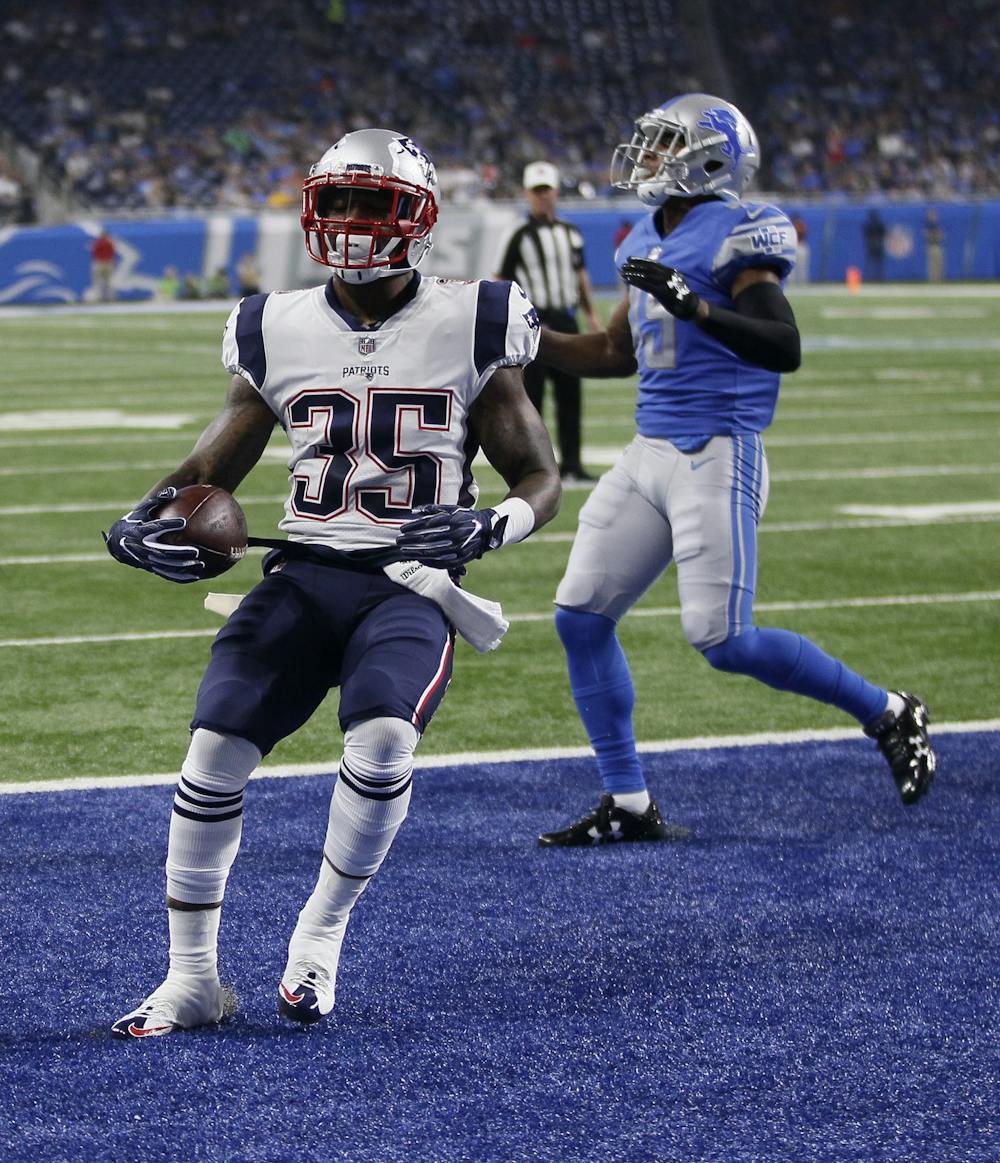 <p>New England Patriots running back Mike Gillislee (35) runs into the end zone for a 1-yard touchdown during the first half of an NFL preseason football game against the Detroit Lions, Friday, Aug. 25, 2017, in Detroit. (AP Photo/Duane Burleson)</p>