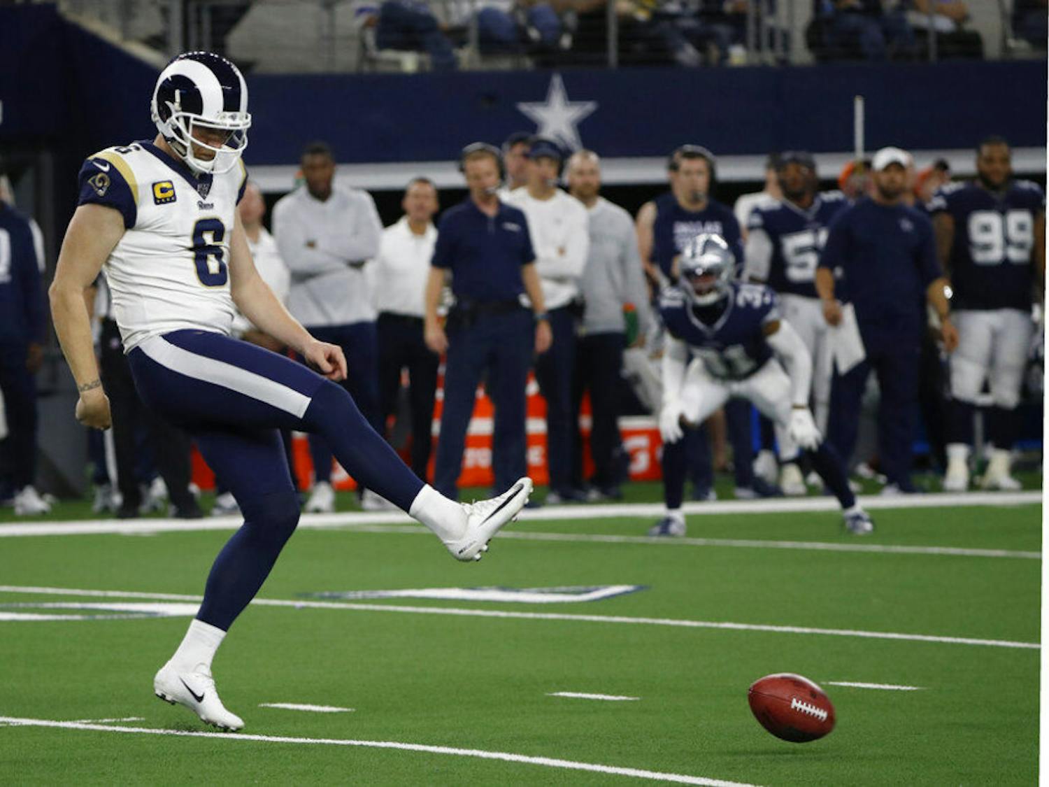 FILE - In this Dec. 15, 2019 file photo Los Angeles Rams punter Johnny Hekker kicks an onside kick during an NFL football game against the Dallas Cowboys in Arlington, Texas. The NFL is considering adding a “booth umpire” and a senior technology advisor to the referee to assist the officiating crew. The league also is looking at other rules changes, including an alternative to the onside kick. NFL clubs received a list of potential rules changes on Thursday, May 21, 2020. (AP Photo/Roger Steinman, file)
