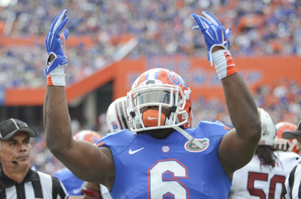 <p>Dante Fowler hypes up the crowd during Florida's 23-20 overtime loss to South Carolina at Ben Hill Griffin Stadium.</p>