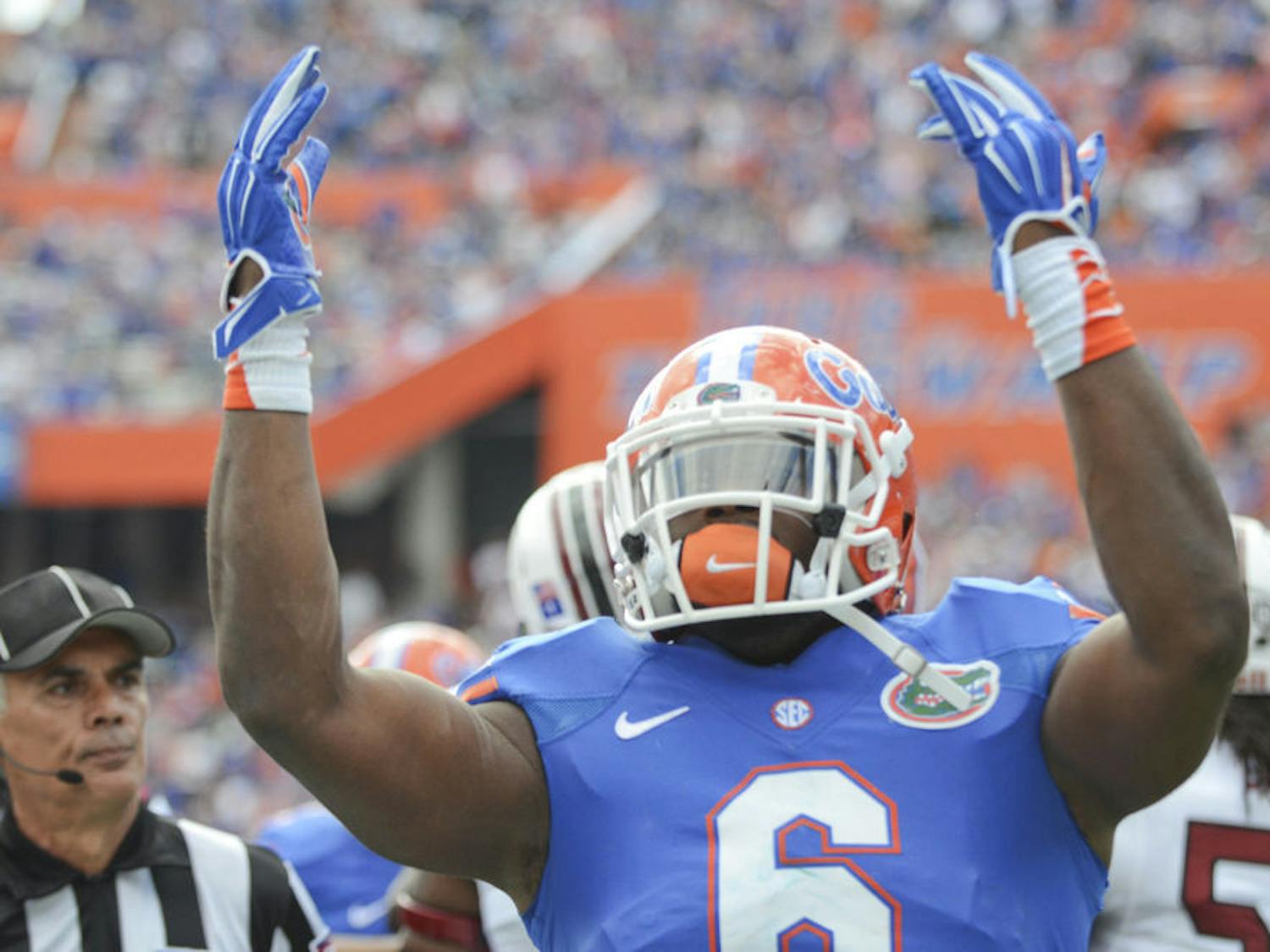 Dante Fowler hypes up the crowd during Florida's 23-20 overtime loss to South Carolina at Ben Hill Griffin Stadium.