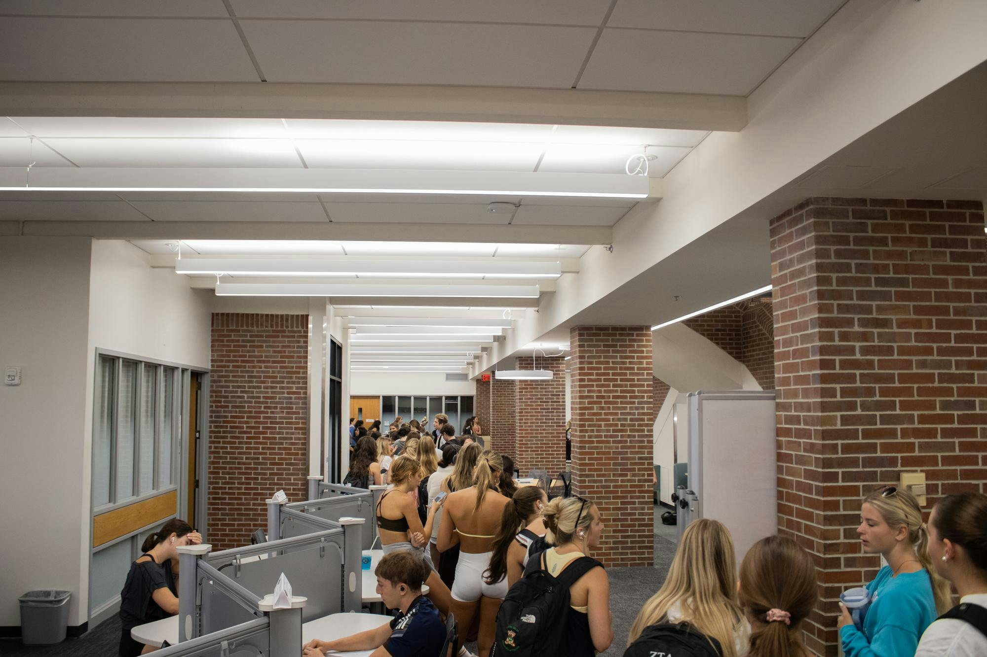 A line of student voters wraps around the inside of Norman Hall Education Library, Tuesday, Sept. 29, 2026, in Gainesville, Fla.