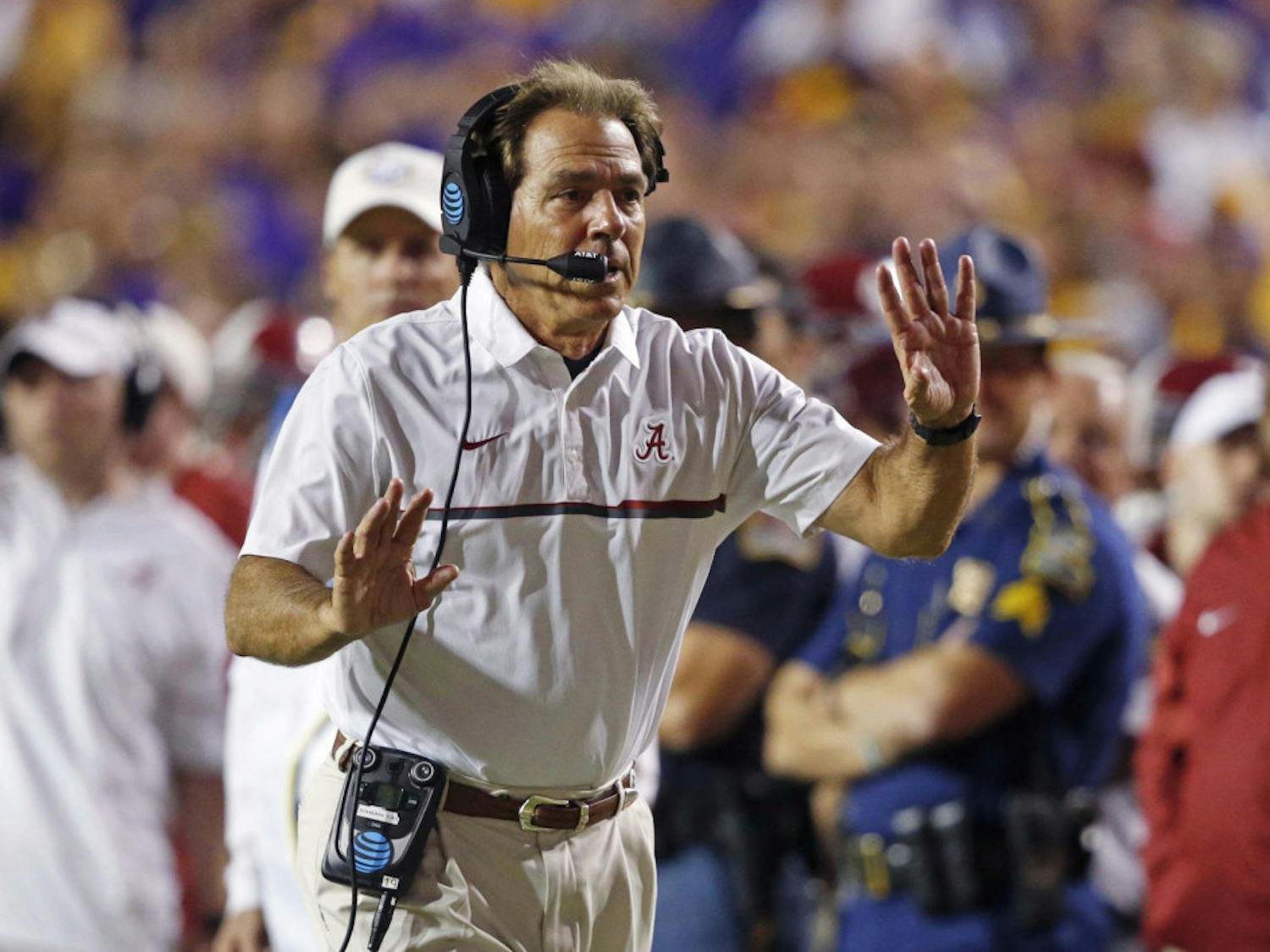 Alabama head coach Nick Saban tries to get the referee's attention as the play clock approaches zero in the second half of an NCAA college football game against LSU in Baton Rouge, La., Saturday, Nov. 5, 2016. Alabama won 10-0. (AP Photo/Gerald Herbert)