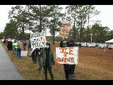 Protestors demonstrate outside detention facility in Baker County, Florida, Sunday, Jan. 18, 2026.