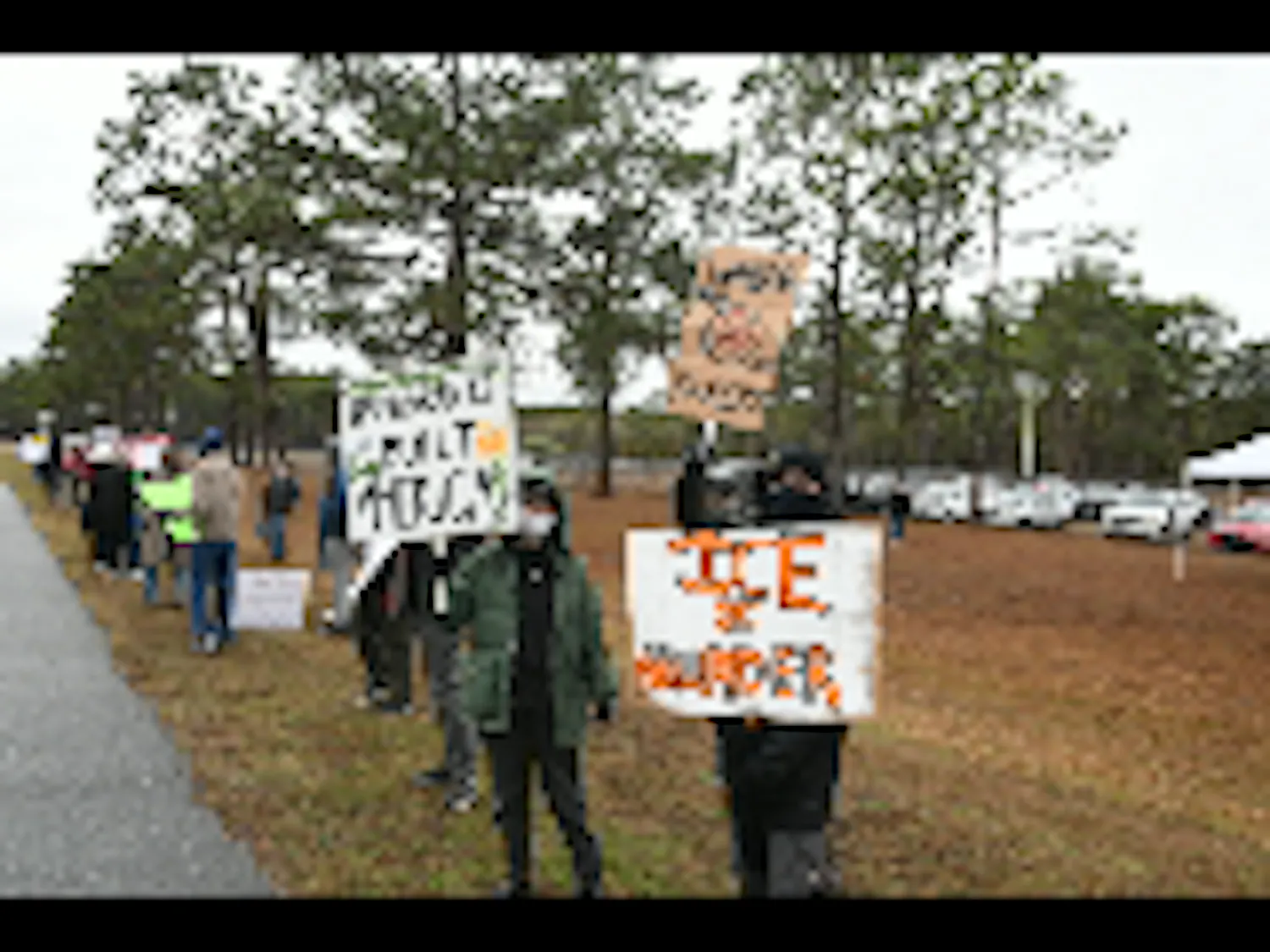 Protestors demonstrate outside detention facility in Baker County, Florida, Sunday, Jan. 18, 2026.