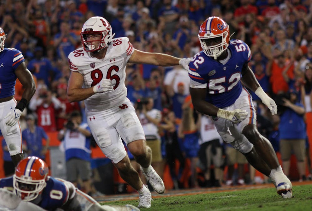 Former UF linebacker Antwaun Powell-Ryland Jr. and former Utah tight end Dalton Kincaid compete in a play in the Gators' 29-26 victory Saturday, Sept. 3, 2023. 