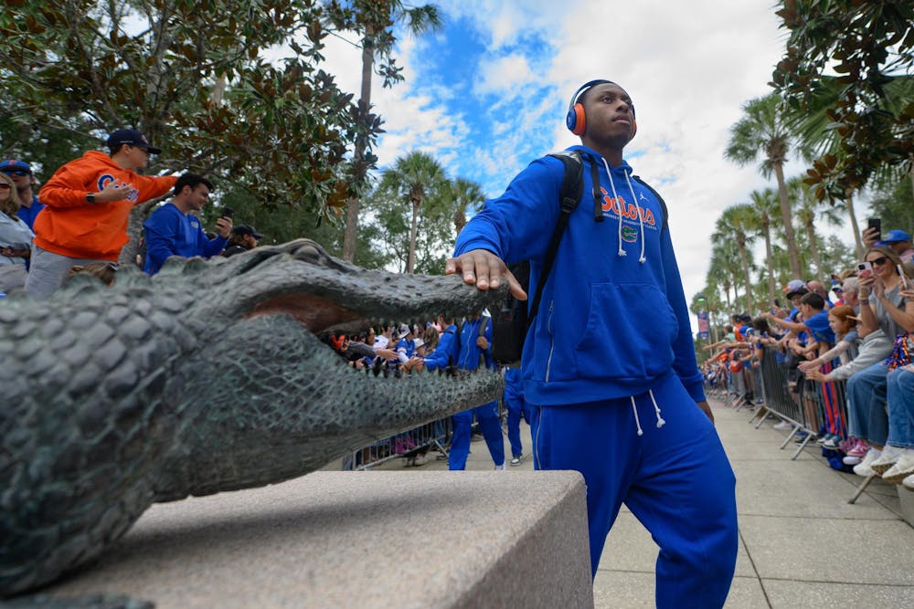 Florida quarterback DJ Lagway (2) touches the gator during Gator Walk before an NCAA college football game against Florida State, Saturday, Nov. 29, 2025, at Ben Hill Griffin Stadium in Gainesville, Fla.