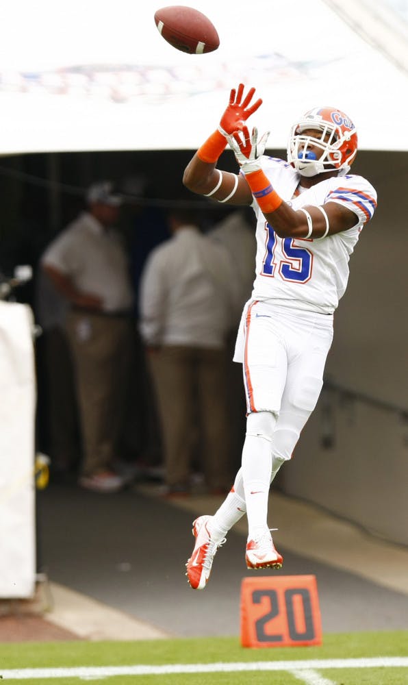 Loucheiz Purifoy (15) catches passes during warmups before Florida’s 17-9 loss to Georgia on Oct. 27 in Jacksonville.