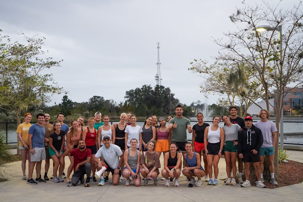 <p>Gainesville Peak Pulse Run Club meets at Depot Park for a pre-run group photo on Nov. 14, 2024.</p>