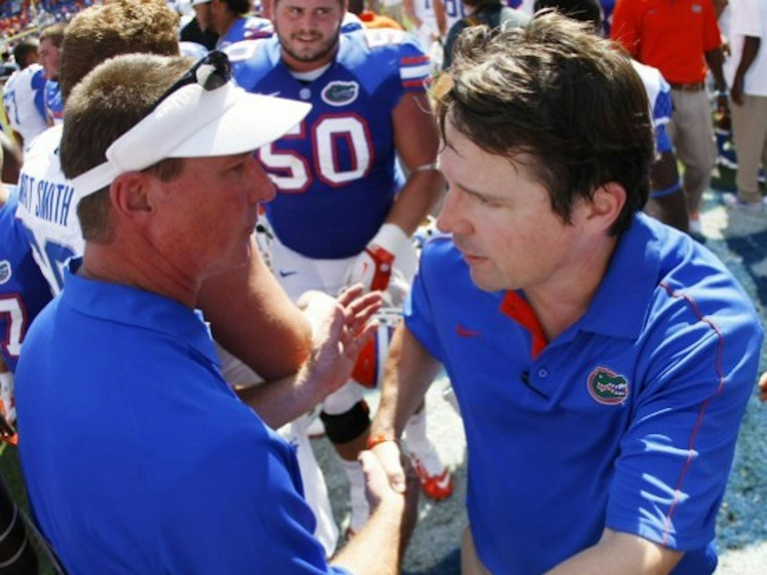 Coach Will Muschamp and Kentucky offensive coordinator Randy Sanders shake hands after Florida’s 38-0 win on Sept. 22 at Ben Hill Griffin Stadium. The Swamp will host an array of football recruits when No. 10 Florida takes on No. 4 LSU.
