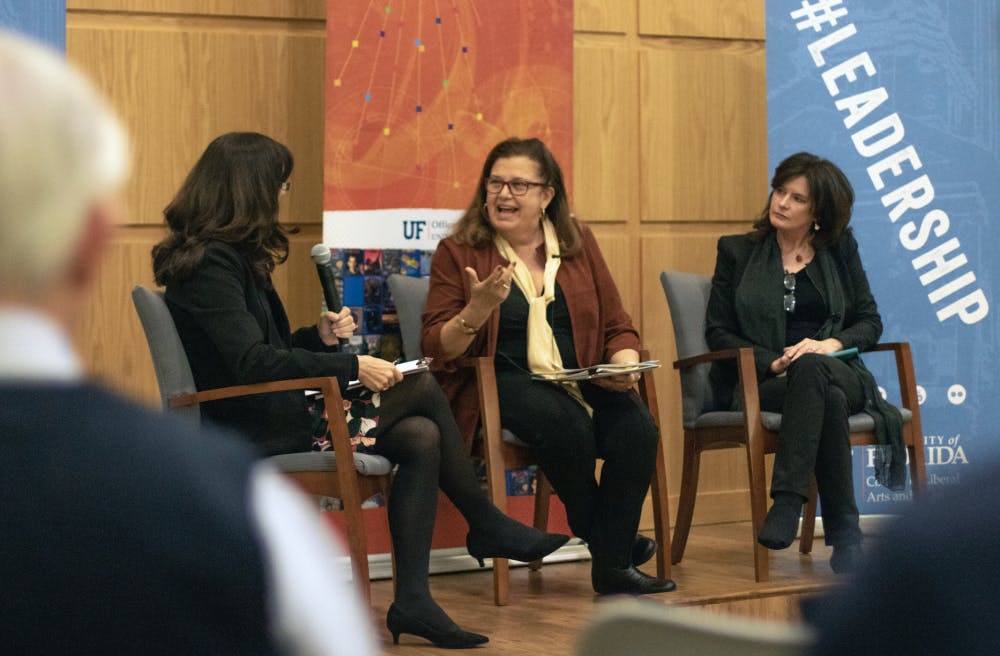 Cindy Spence (left), a reporter for UF’s Explore magazine, interviews UF professors Martha Koehn (middle) and Nancy Clark (right) Wednesday night in the Pugh Hall Ocora. The two professors in the College of Design, Construction and Planning talked about their work in rehabilitating Puerto Rico after Hurricane Maria. 
