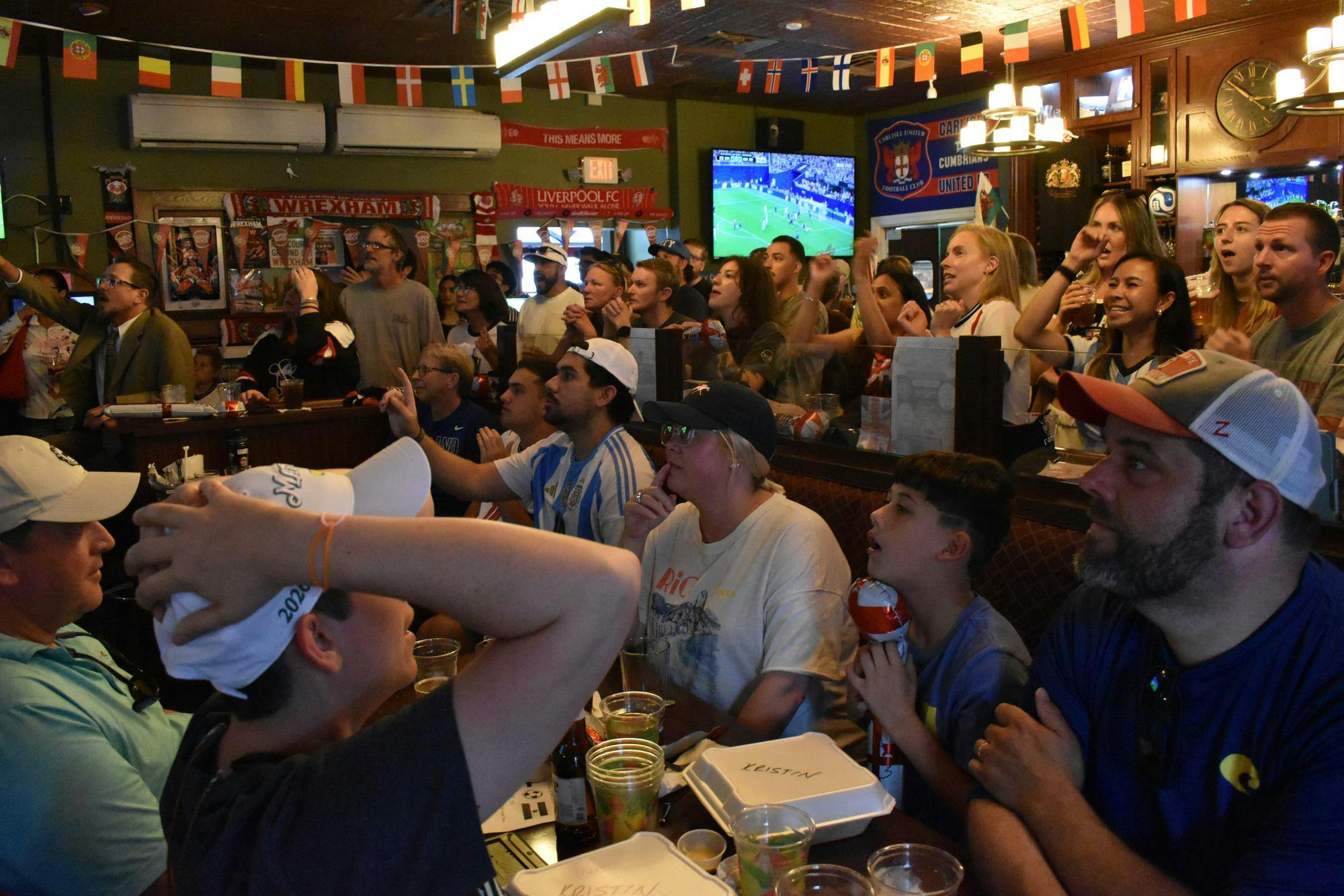 Fans at Haile Village Bistro & Queens Arms Pub intensely watch the 2026 Semifinals match between England and Argentina Wednesday, July 15, 2026 in Gainesville, Fla.