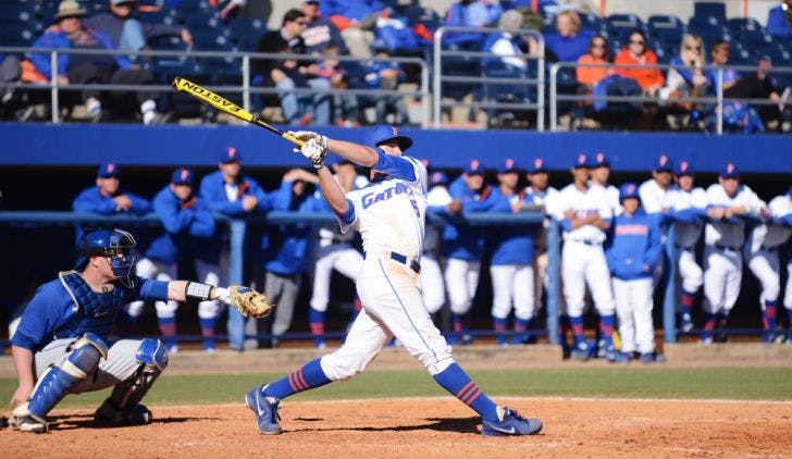 Sophomore first baseman Zack Powers hits the second of his two grand slams during Florida’s 16-5 win against Duke on Sunday at McKethan Stadium. Powers, who missed 2012 with a torn labrum, finished the Gator’ series-clinching victory with nine RBI.