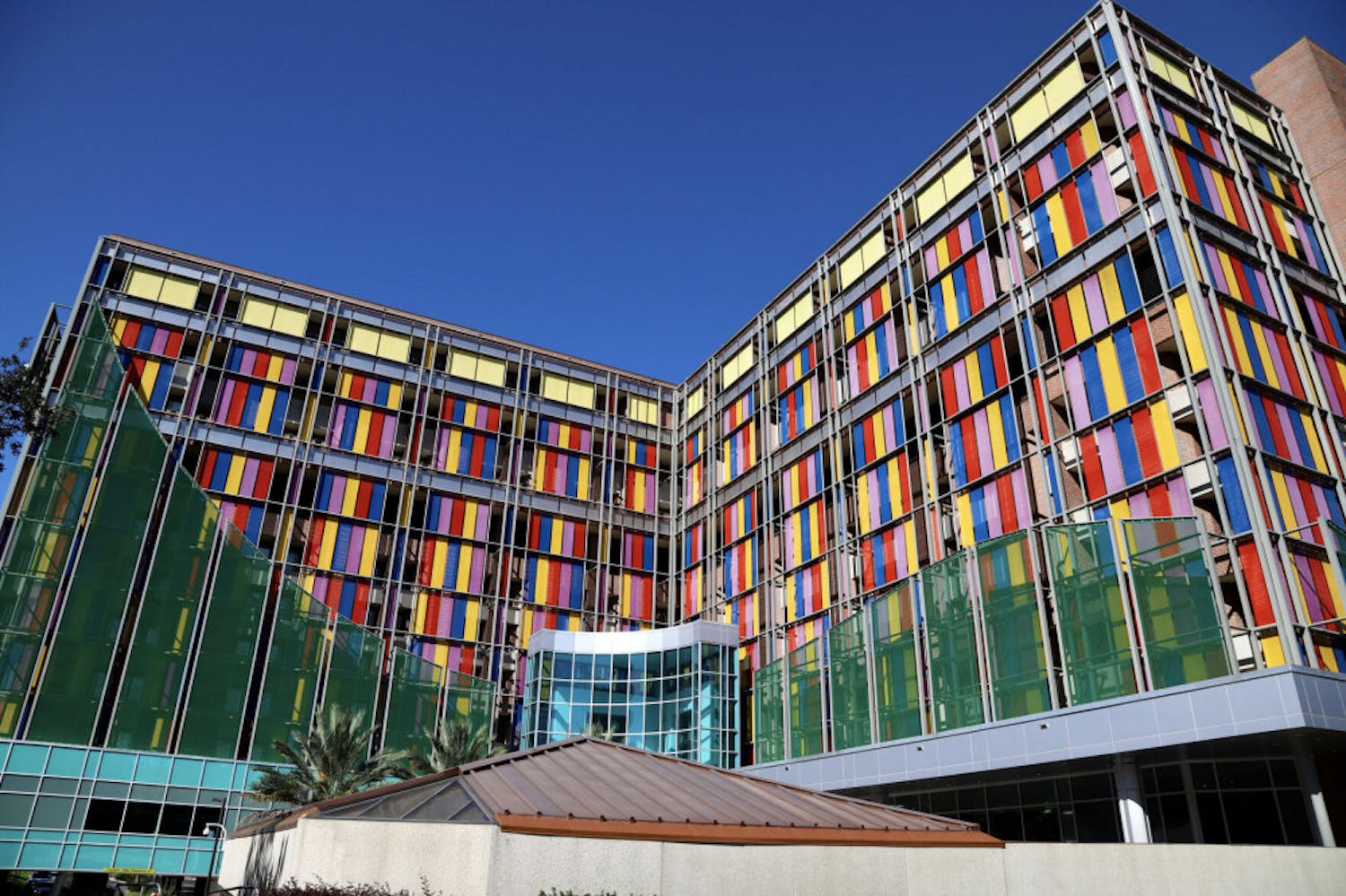 The multi-colored glass of the UF Health Shands Children’s Hospital shines as the sun reflects off the panes on September 25, 2020. The pediatric staff provide care in more than 20 specialities including pediatric hematology-oncology.