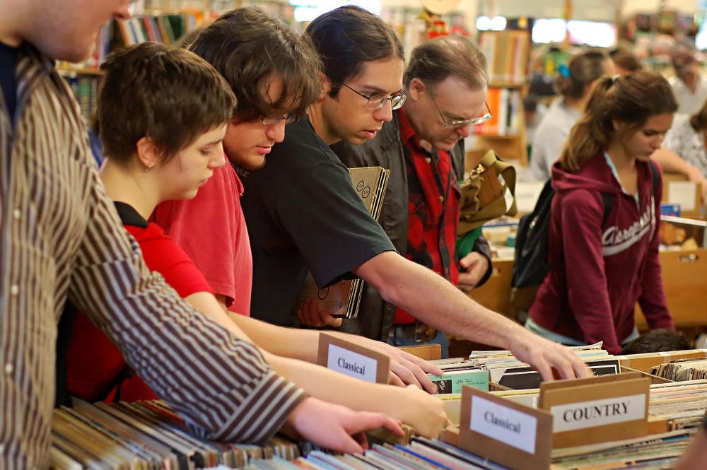 (Andrew Stanfill / Alligator Staff) Crowds shop for records at the Friends of the Library book sale Saturday morning.