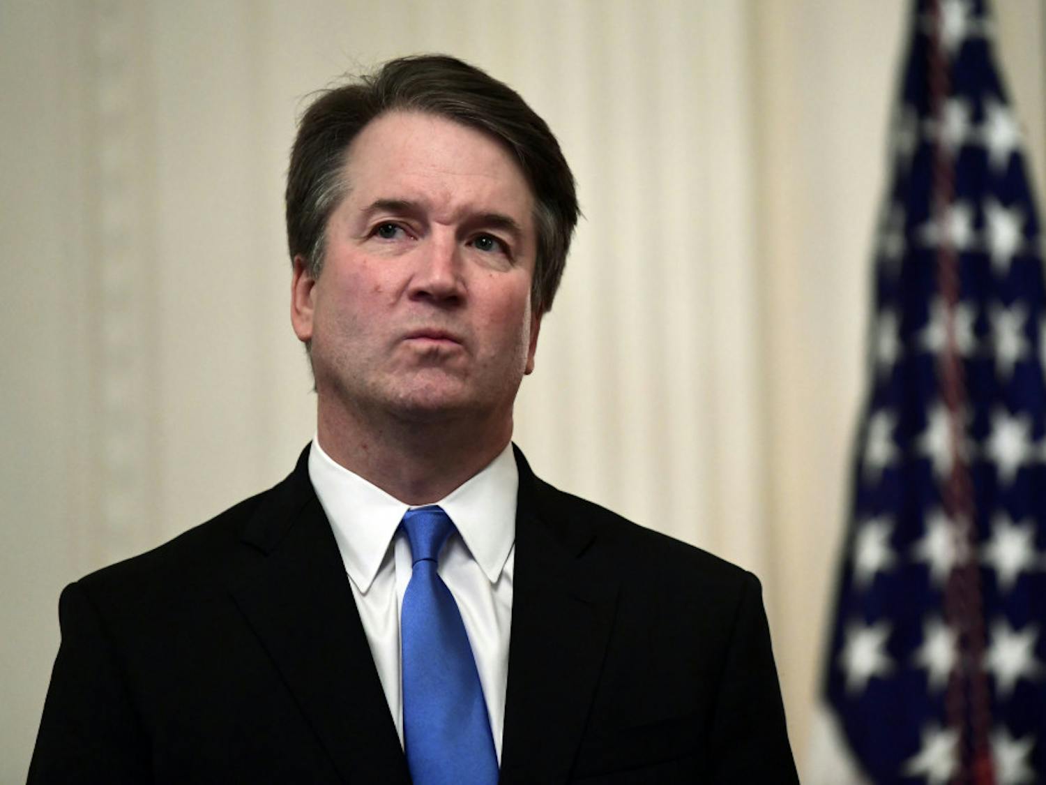 In this Oct. 8, 2018 photo, Supreme Court Justice Brett Kavanaugh stands before a ceremonial swearing-in in the East Room of the White House in Washington. At least two Democratic presidential candidates, Kamala Harris and Kamala Harris are calling for the impeachment of Supreme Court Justice Brett Kavanaugh in the face of a new, uninvestigated, allegation of sexual impropriety when he was in college. (AP Photo/Susan Walsh, File)