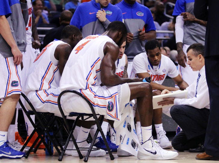 Billy Donovan reviews team plays during the second half of&nbsp;Florida’s 61-45 win against Pittsburgh on Saturday during the 2014 NCAA Tournament. The victory advanced the Gators will face UCLA on Thursday