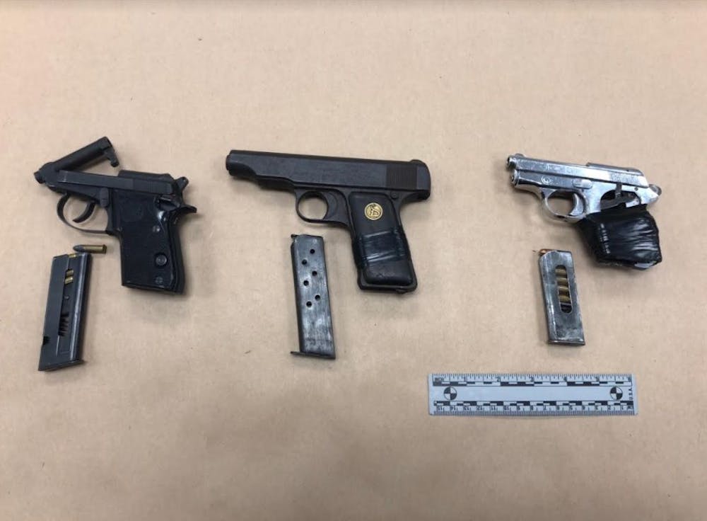 <p>Pictured are the weapons that were found after Gainesville Police officers arrested two men Tuesday night. Courtesy of the Gainesville Police Department.&nbsp;</p>