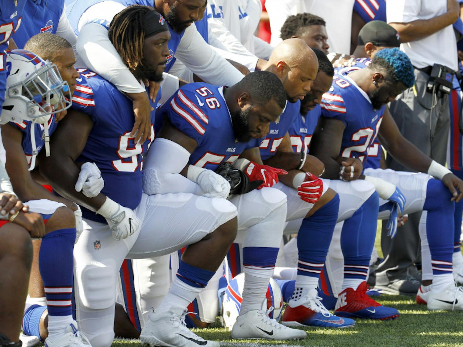 Buffalo Bills players kneel during the national anthem prior to an NFL football game against the Denver Broncos, Sunday, Sept. 24, 2017, in Orchard Park, N.Y. (AP Photo/Jeffrey T. Barnes)