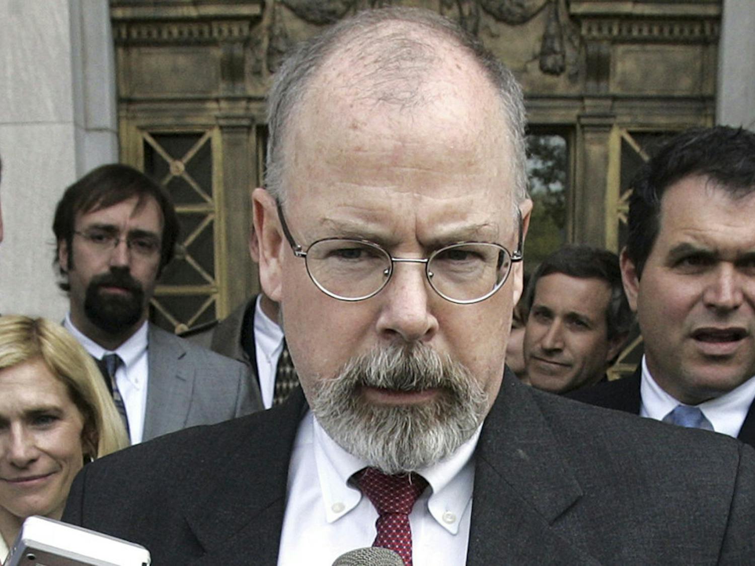 FILE - In this April 25, 2006, file photo, John Durham speaks to reporters on the steps of U.S. District Court in New Haven, Conn. Durham, Connecticut’s U.S. attorney, is leading the investigation into the origins of the Russia probe. He is no stranger to high-profile, highly scrutinized investigations. (AP Photo/Bob Child, File)