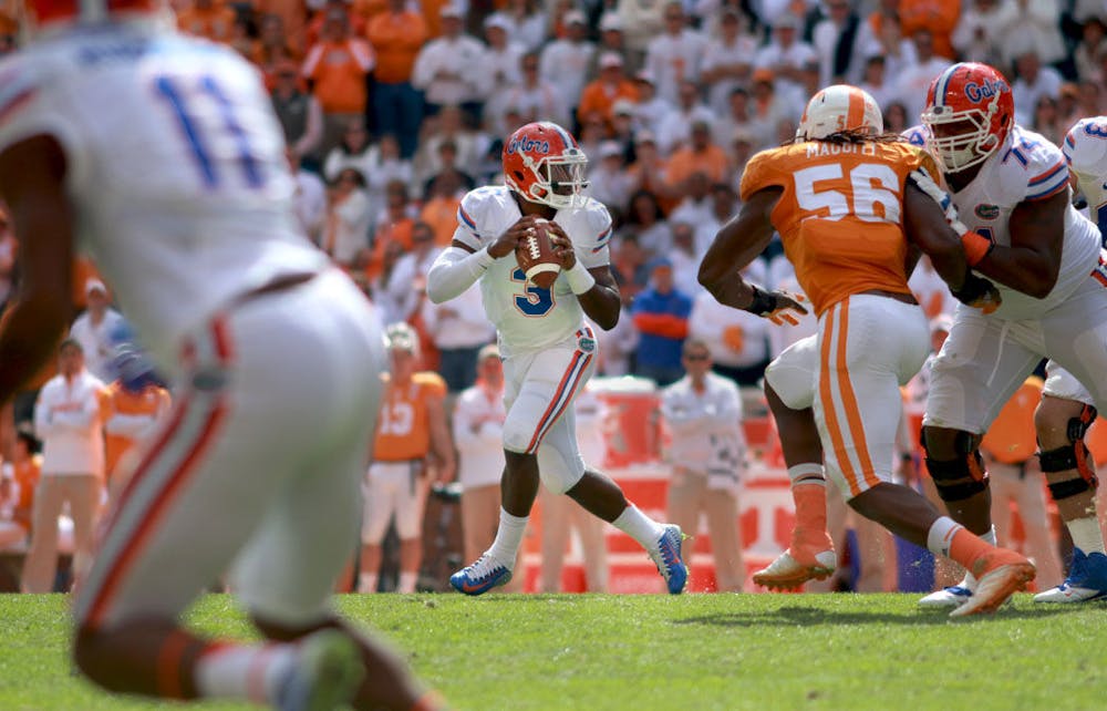 <p>Freshman quarterback Treon Harris looks to pass the ball during the fourth quarter of Florida's 10-9 victory against Tennessee on Saturday at Neyland Stadium in Knoxville.</p>