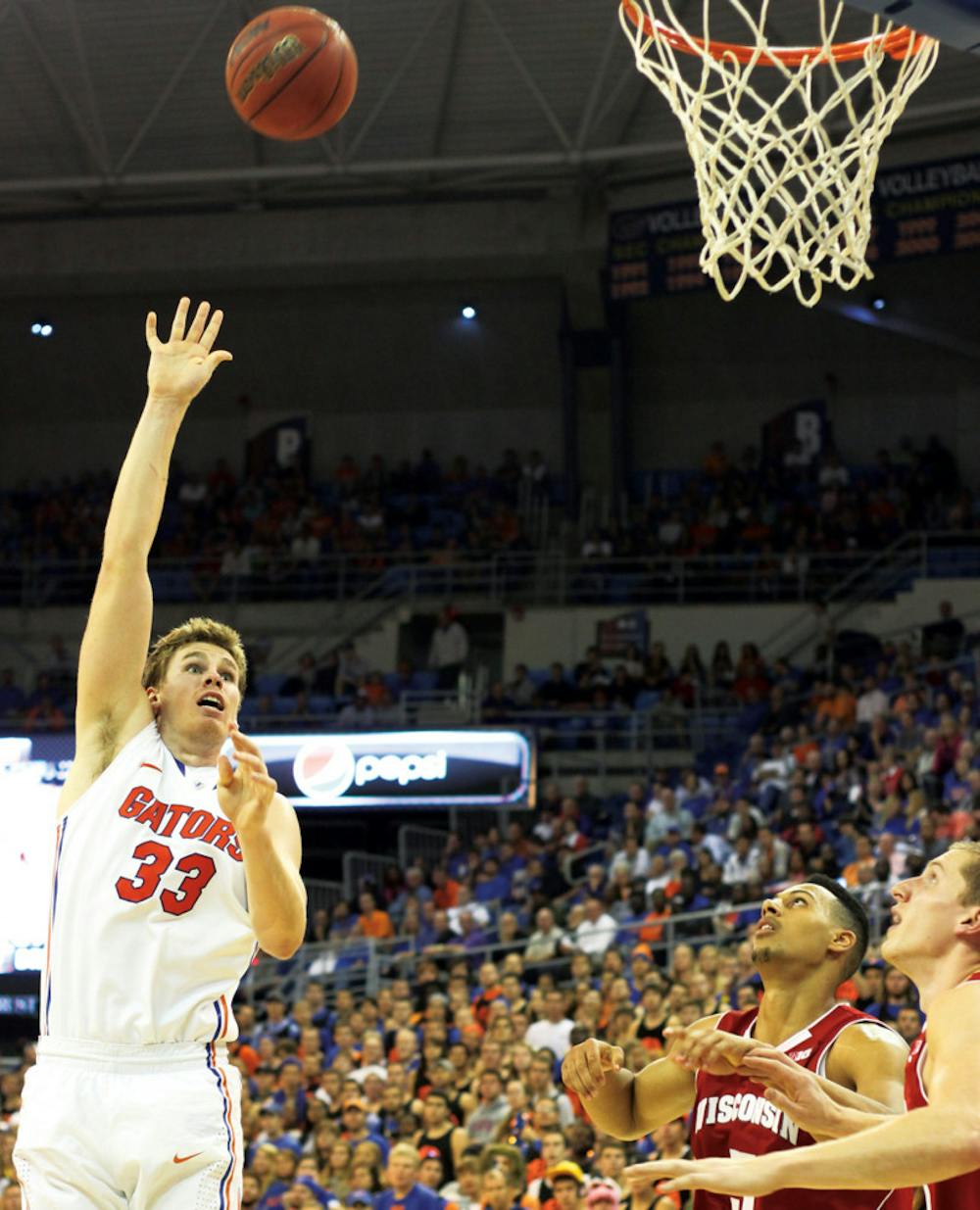 <p>Forward Erik Murphy (33) attempts a shot in UF’s 74-56 win against Wisconsin on Wednesday in the O’Connell Center. Murphy tied a career high with 24 points.</p><div> </div>