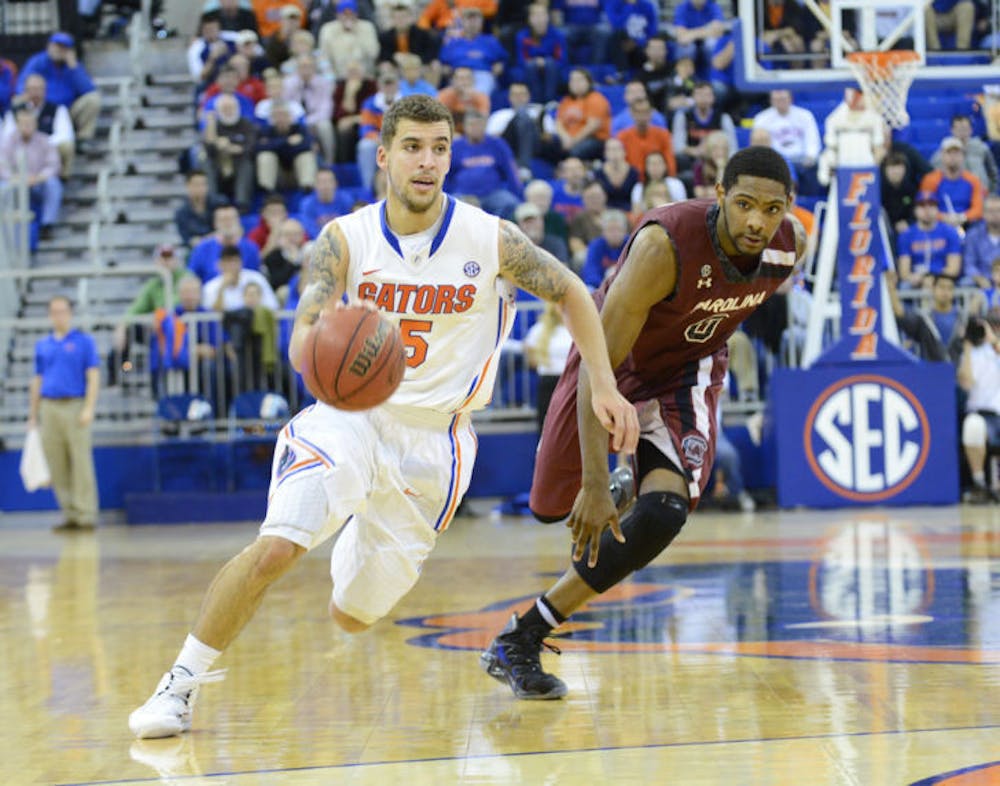 <p>Scottie Wilbekin drives down the lane during Florida’s win against South Carolina in the O’Connell Center on Wednesday. Wilbekin finished second on the team with 18 points in Florida’s 84-82 overtime win against Arkansas on Saturday.</p>