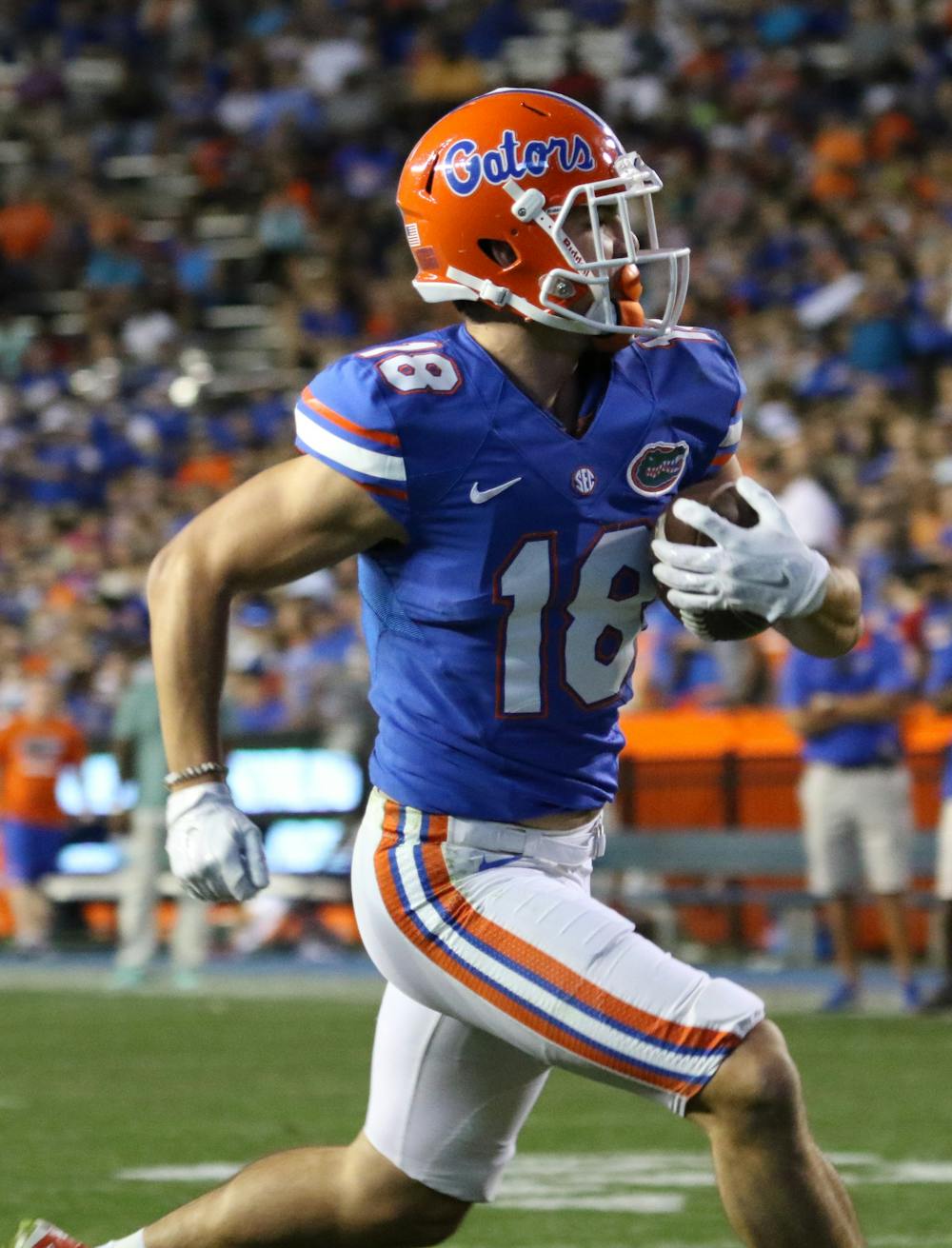 <p>Wide receiver CJ Worton runs into the end zone for a touchdown after recovering a fumble from running back Mark Thompson (not pictured) during the Orange &amp; Blue Debut on April 8, 2016, at Ben Hill Griffin Stadium.</p>
