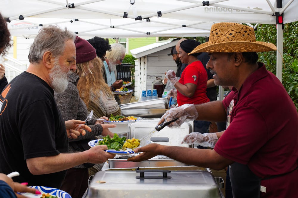 <p>Chef Amnaya Awasthi of Braised Yum serves biryani to event visitors at the A. Quinn Jones Museum on Sunday, Feb. 16, 2025.</p>