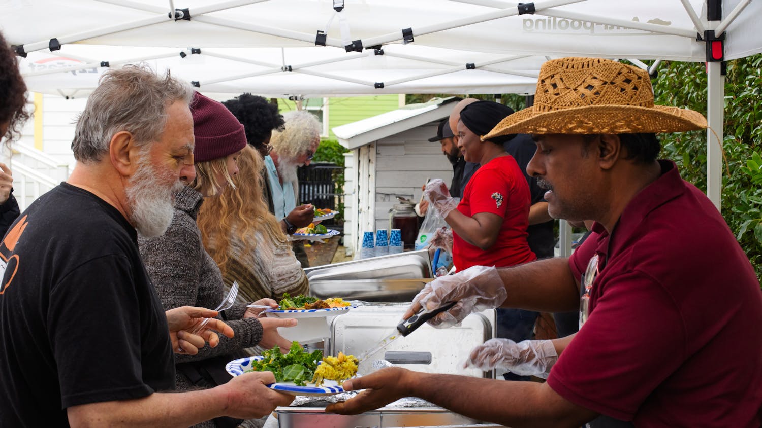 Chef Amnaya Awasthi of Braised Yum serves biryani to event visitors at the A. Quinn Jones Museum on Sunday, Feb. 16, 2025.