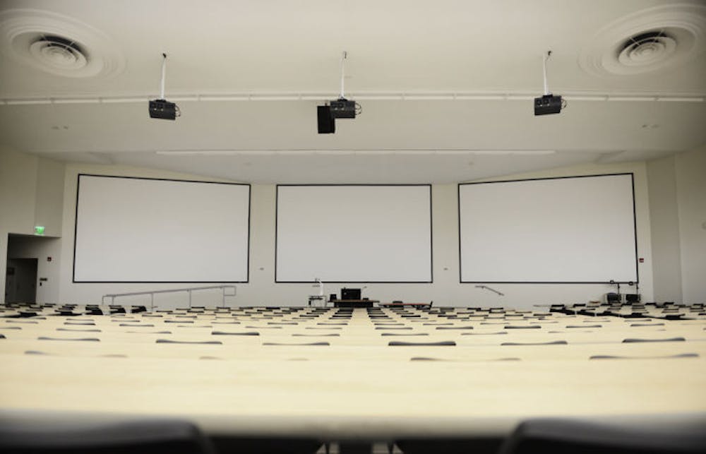 <p>Three new projector screens, each 20 feet wide, hang in Carleton Auditorium as part of UFIT's major renovation project for the summer. Additional work included water damage repairs, improved lighting and stage ability, as well as the installation of a new audio system and high definition projectors.</p>