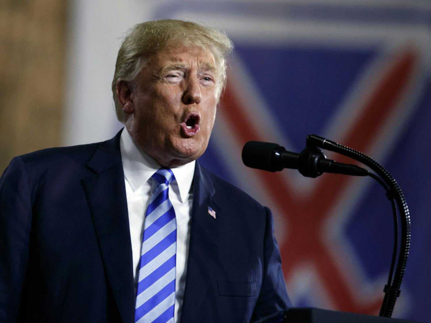 President Donald Trump speaks at Fort Drum, N.Y., Monday, Aug. 13, 2018, before a signing ceremony for a $716 billion defense policy bill named for Sen. John McCain. (AP Photo/Carolyn Kaster)