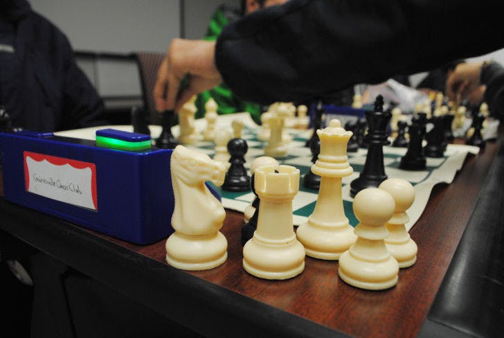 Members of Gainesville Chess Club compete Wednesday night in Larsen Hall. The event was to help recruit new members and offered a $50 cash prize.