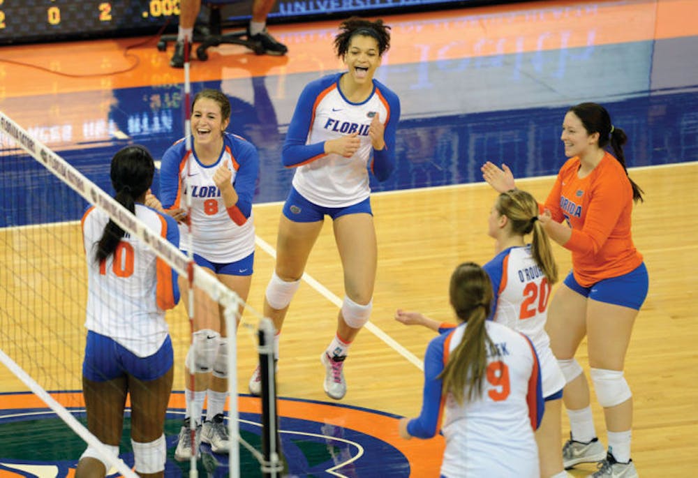 <p>Alex Holston celebrates with teammates during Florida’s three-set win against Tennessee on Oct. 27 in the O’Connell Center. The freshman is third on the Gators in kills per set.</p>