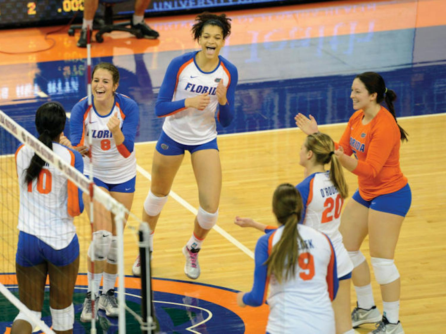 Alex Holston celebrates with teammates during Florida’s three-set win against Tennessee on Oct. 27 in the O’Connell Center. The freshman is third on the Gators in kills per set.
