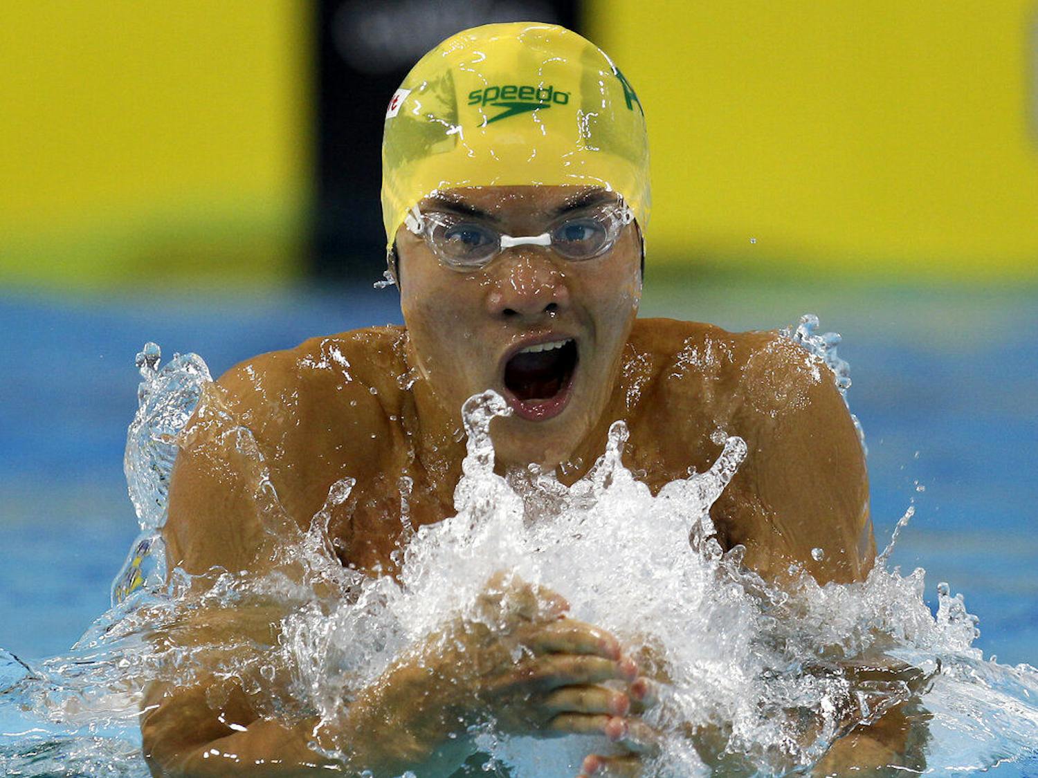 FILE - In this Saturday, Dec. 18, 2010 file photo, Kenneth To from Australia swims a Men's 100 meter Individual Medley heat at the FINA Short Course Swimming World Championships in Dubai, United Arab Emirates. Kenneth To, a former swimming world championships medalist for Australia, died Tuesday March 19, 2019, after falling ill training with the University of Florida. He was aged 26. (AP Photo/Michael Sohn, File)