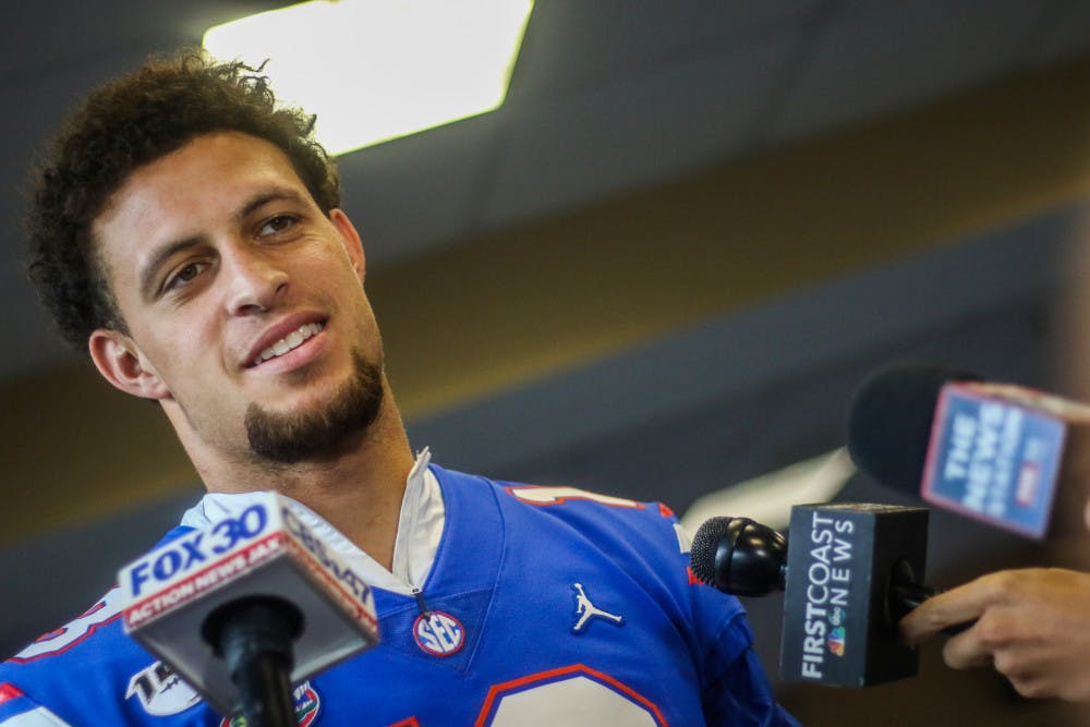 <p>UF quarterback Feleipe Franks takes questions from reporters at football media day on Thursday.</p>