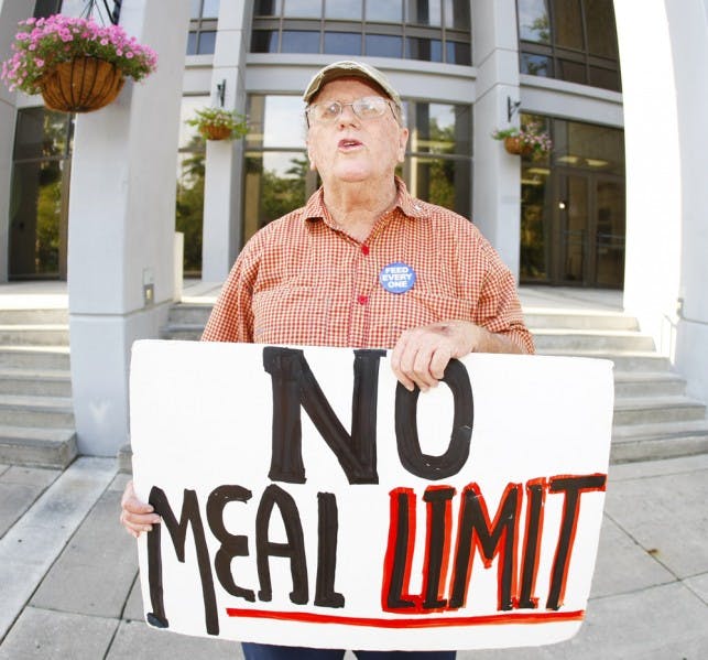 Pat Fitzpatrick stands outside City Hall on Monday afternoon. Fitzpatrick and other protestors were arrested last October for trespassing on Bo Diddley Community Plaza.