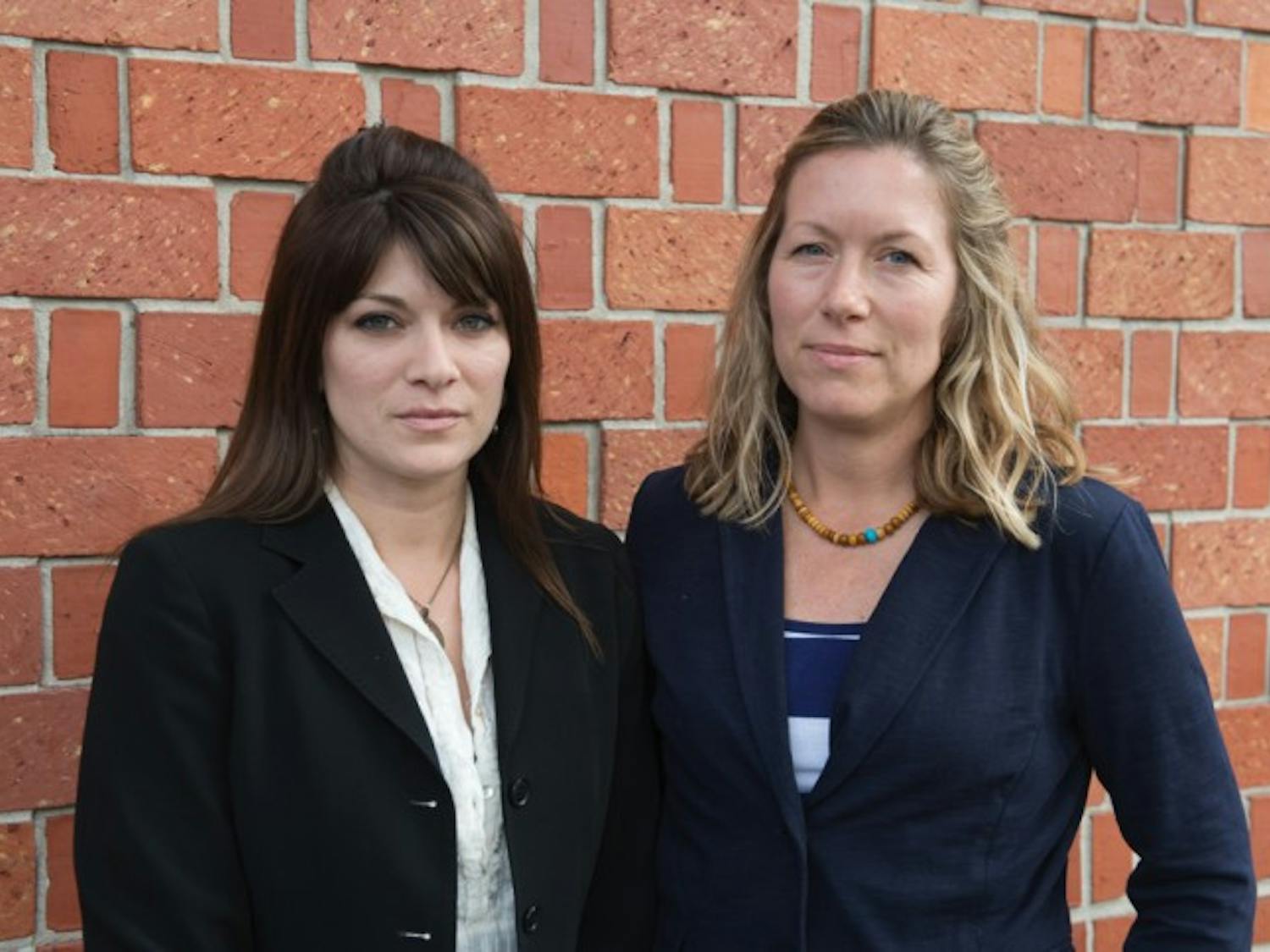 Danielle Ruiz, left, stands with Laura Kalt, her victim advocate at the Gainesville Police Department. Victims can receive free, confidential counseling by contacting the Alachua County Rape Crisis center at 352-264-6760.