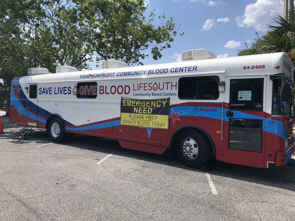 <p><span>A LifeSouth blood mobile sits outside of the Publix at the West Gate Shopping Center. “Emergency need” signs have been added to all of their blood mobiles during the summer. Photo by Joseph Salvador</span></p>