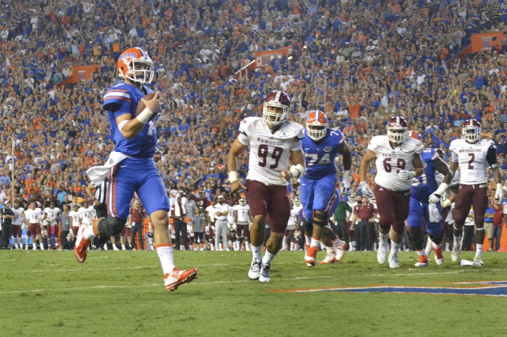 <p>UF quarterback Will Grier rushes for a touchdown during Florida's 61-13 win against New Mexico State on Sept. 5, 2015, at Ben Hill Griffin Stadium</p>